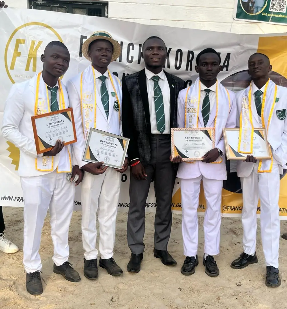 Scholarship recipients with their certificates